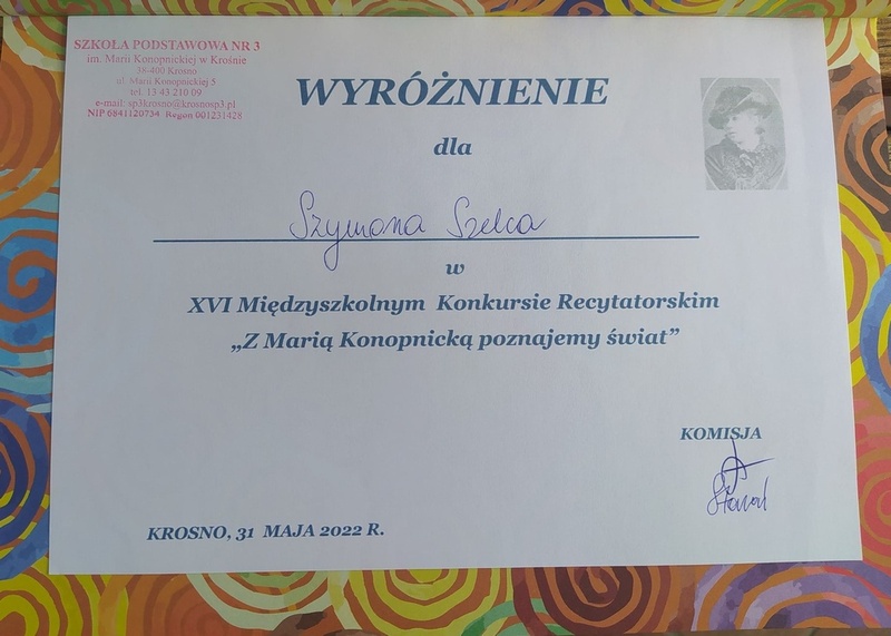 Dyplom wyróżnienia dla Szymona Szelca za prezentacje wiersza pt. Co mówi zegar